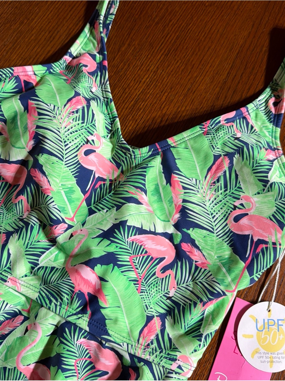 Ruffle Butts Pink Hang Tag with UPF 50+ Sun Graphic